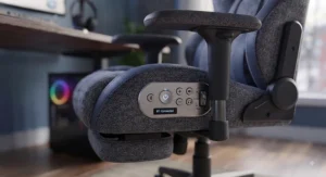 Close-up of gaming chair controls for bluetooth speakers and adjustable seat settings.