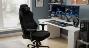 A black and blue fabric gaming chair featured in a modern desk setup with dual monitors.